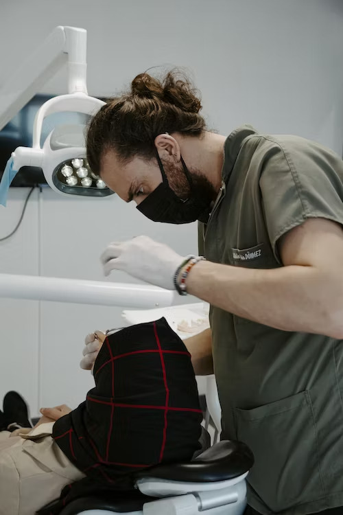 a dentist performing a dental cleaning 